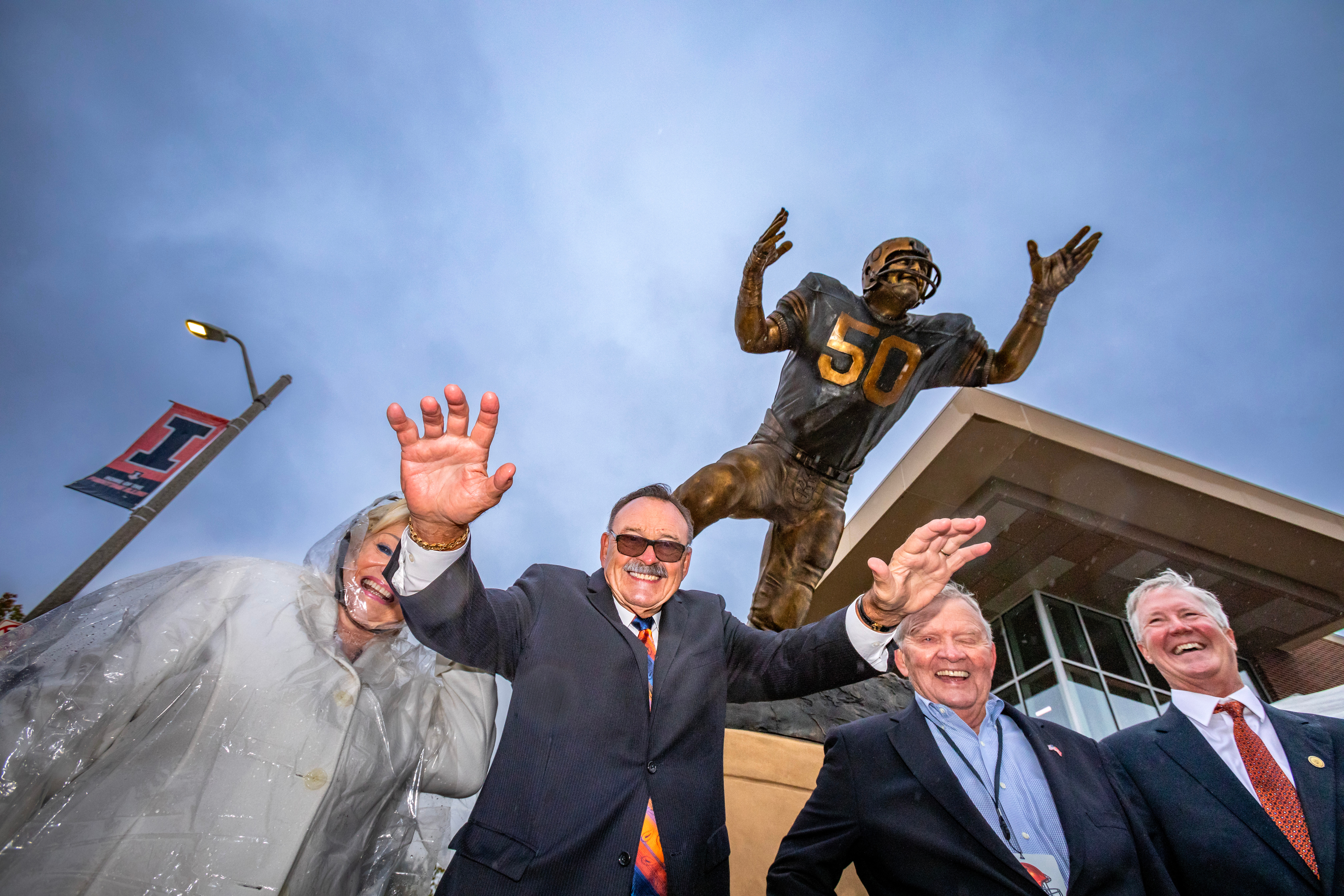 Dick Butkus at his University of Illinois statue unveiling in 2019.