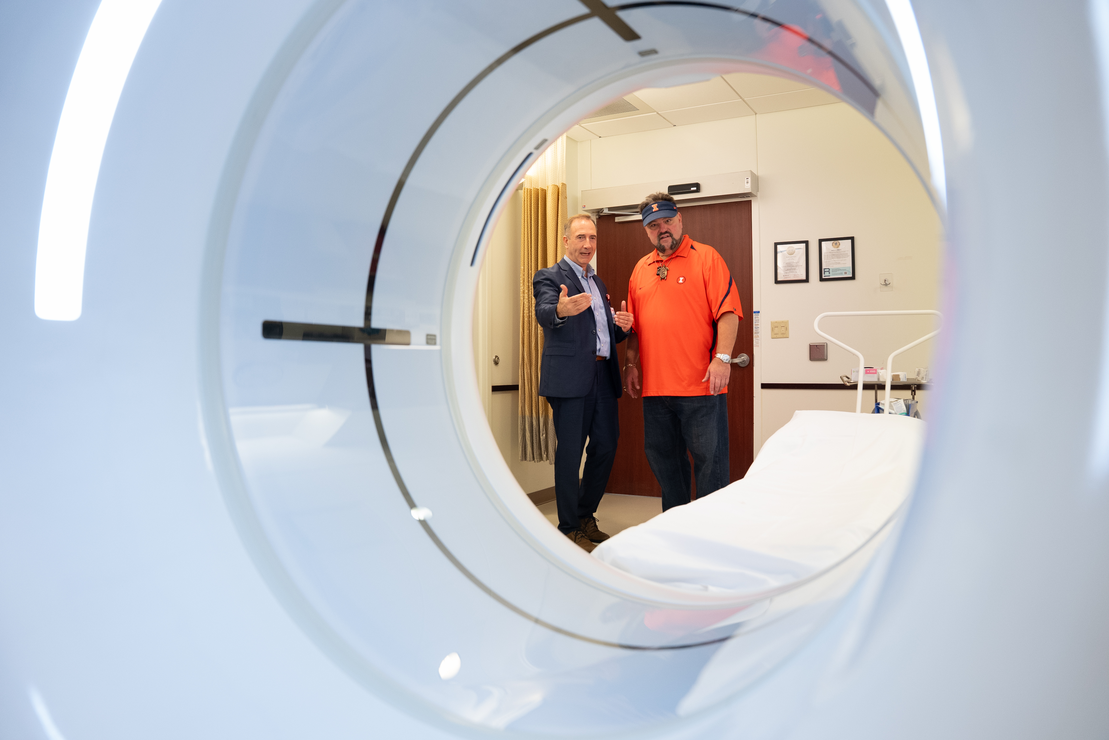 With a cardiac CT machine in the foreground, Dr. Issam Moussa is pictured with Matt Butkus of the Butkus Foundation on September 25, 2025 at Carle Foundation Hospital.