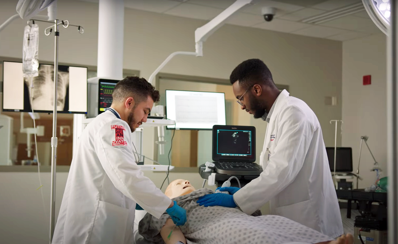 Students in the Jump Simulation Center working with a manikin.