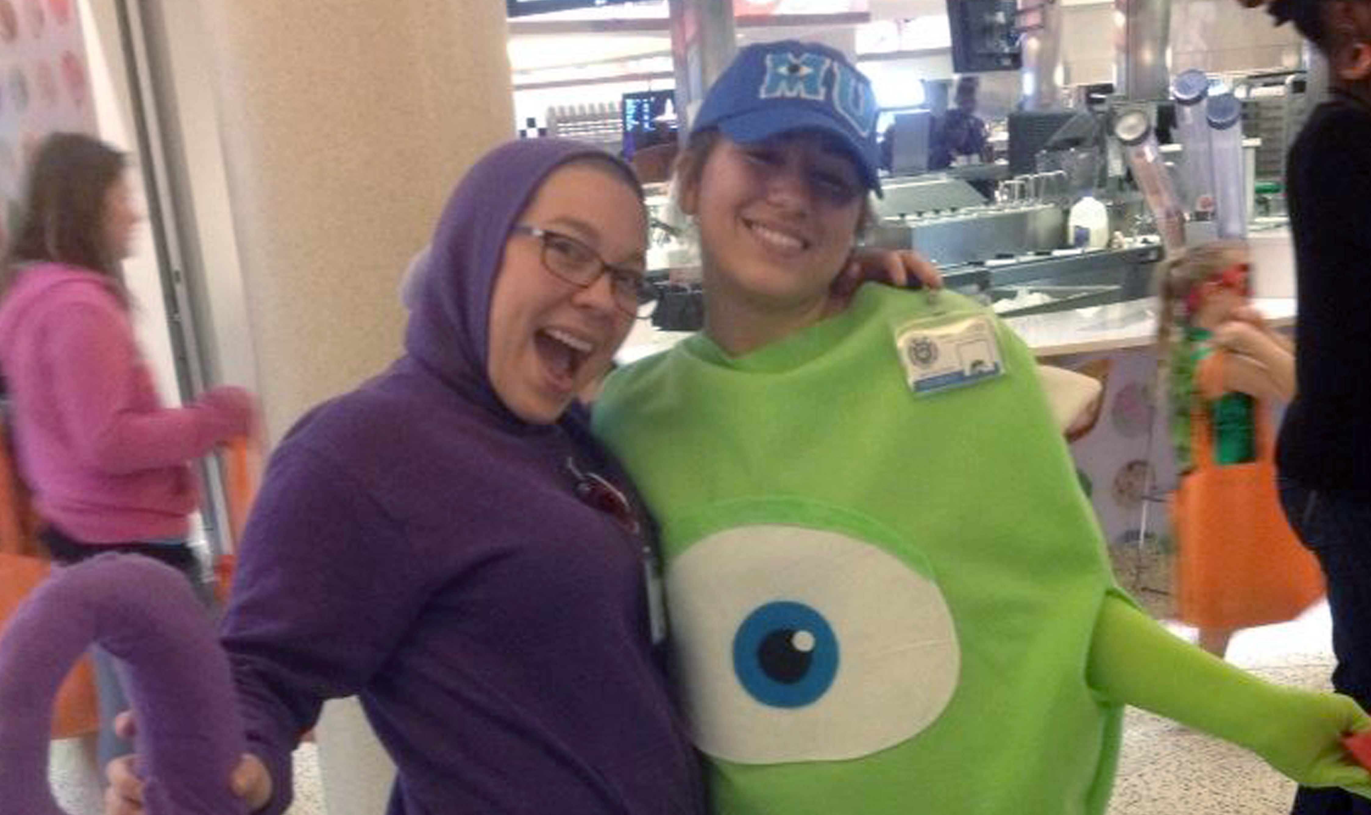 Lidija and coworker dressed as monsters for a Halloween party