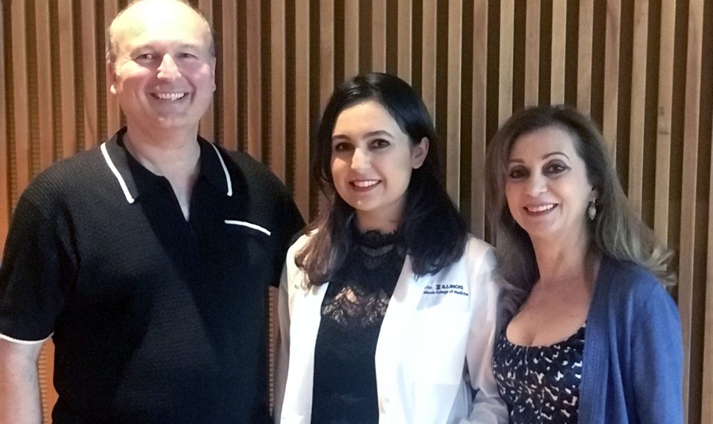 Roxy with her parents at her Carle Illinois white coat ceremony.