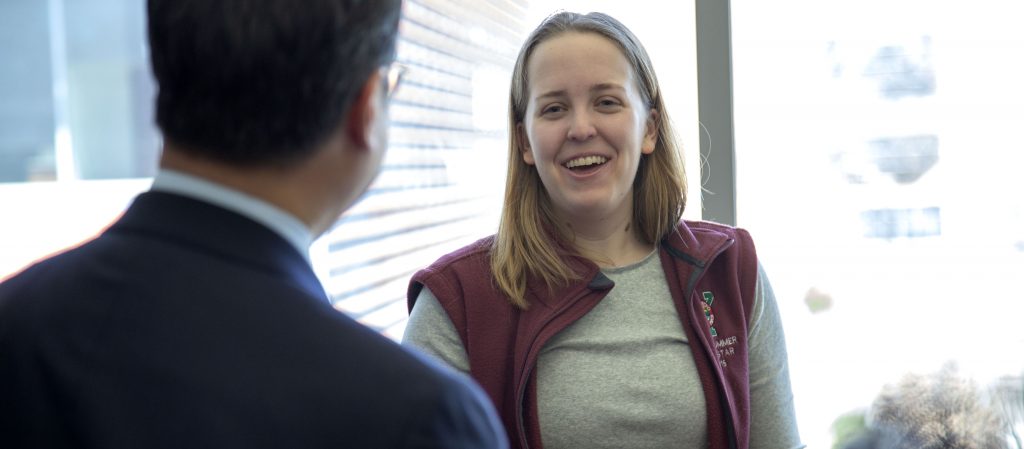 Elizabeth receiving a surprise offer of admittance to Carle Illinois from Dean King Li.