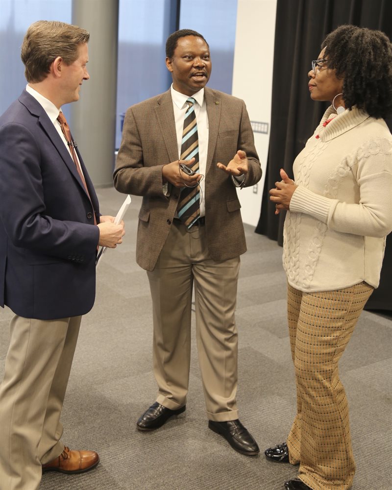 Speaker Samuel Achilefu, Ph.D. (center), talks with Stephen Boppart, Ph.D., and Ruby Mendenhall, Ph.D., who serve as Carle Illinois' Executive Associate Dean and Chief Diversity Officer, and Assistant Dean for Diversity and Democratization of Health Innovation, respectively.