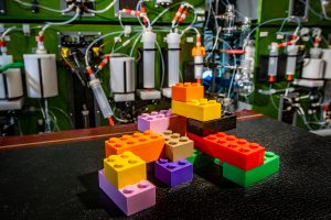 A next generation molecule machine created by University of Illinois chemistry professor Martin D. Burke and fellow researcher Dr. Daniel J. Blair is designed to synthesize small molecules using a building blocks approach to recreate complex natural products. This new approach for creating chemical matter could greatly expand new drug development innovations, as well as open doors to technologies that rely on small molecules.