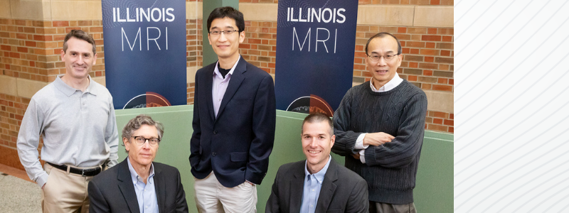 Scientists at the University of Illinois Urbana-Champaign developed a method to noninvasively image DNA methylation, allowing new explorations of the mechanisms that regulate gene expression in the brain. The team includes, from left, chemistry professor Scott Silverman; entomology professor Gene Robinson, the director of the Carl R. Woese Institute for Genomic Biology; bioengineering professor Fan Lam; animal sciences professor Ryan Dilger; and electrical and computer engineering professor Zhi-Pei Liang.

Photo by L. Brian Stauffer