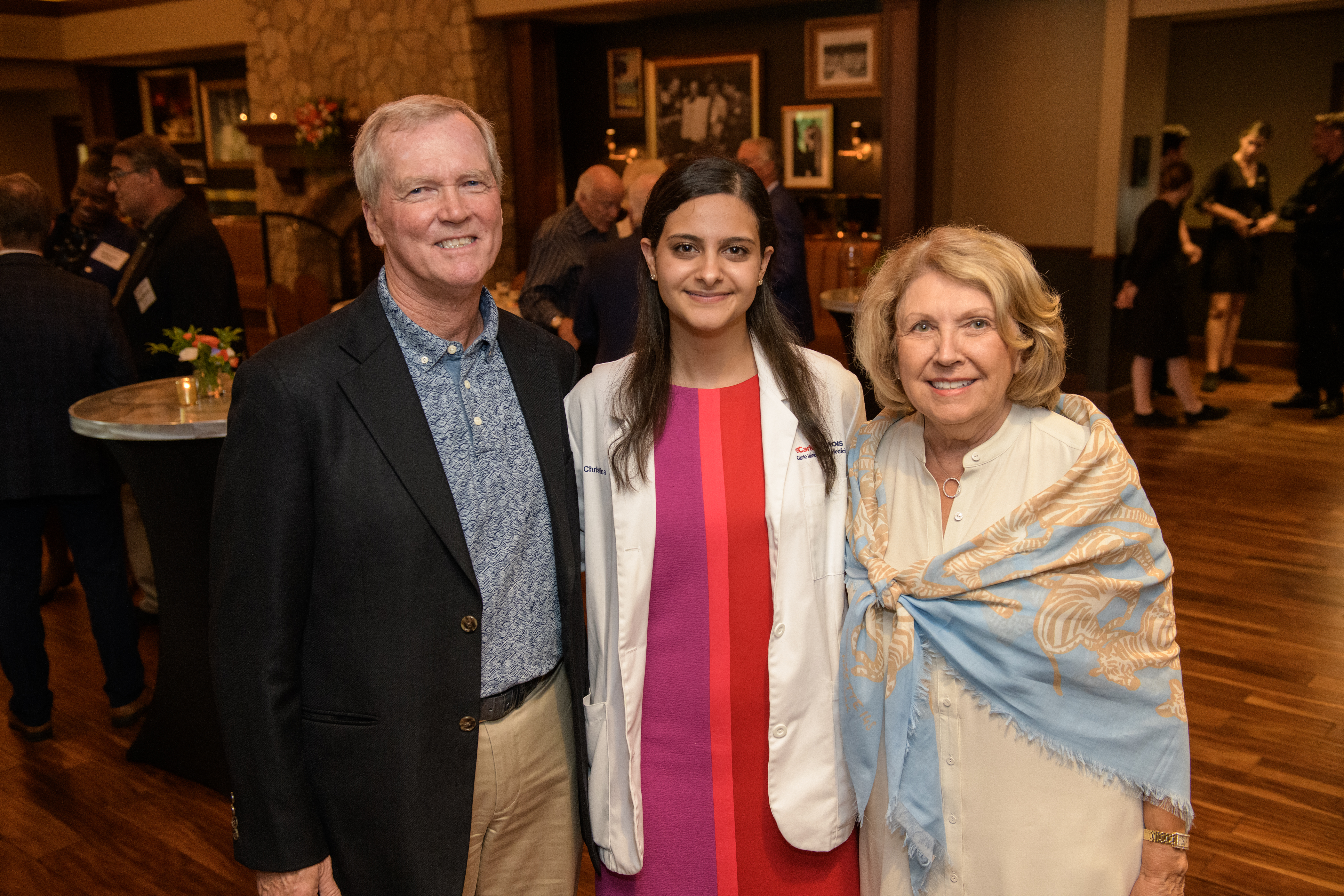 Rick and Jeanene Stephens (left and right) with Christina Moawad (center), Carle Illinois Class of 2022.