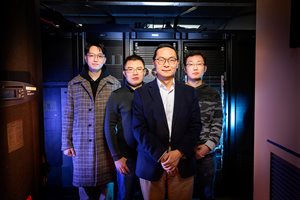 <em>An Illinois research team created an AI tool to predict an enzyme&rsquo;s function from its sequence using the campus network and resource group servers. Pictured, from left: Tianhao You, Haiyang (Ocean) Cui, Huimin Zhao and Guangde Jiang.&nbsp;</em><br><em>Photo by Fred Zwicky</em>