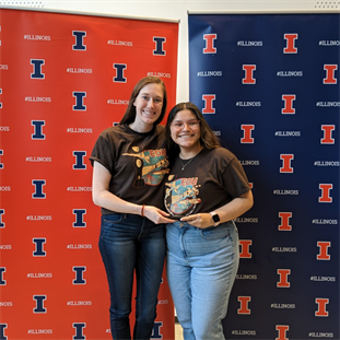 CI MED first year student Neddie Byron (left) and undergraduate student Adrianna Ramos (right) pose with the first-place trophy at the Engineering Open House Startup Showcase.